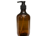 Brown glass bottle with black pump dispenser on a white background