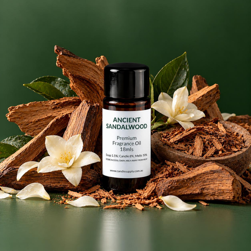 Ancient Sandalwood fragrance oil bottle with split wood, wood shavings, green leaves and white flowers.