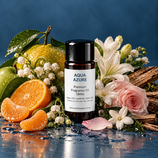 Aqua Azure fragrance oil bottle with citrus fruit, white flowers, a pink rose and driftwood on a wet blue surface.