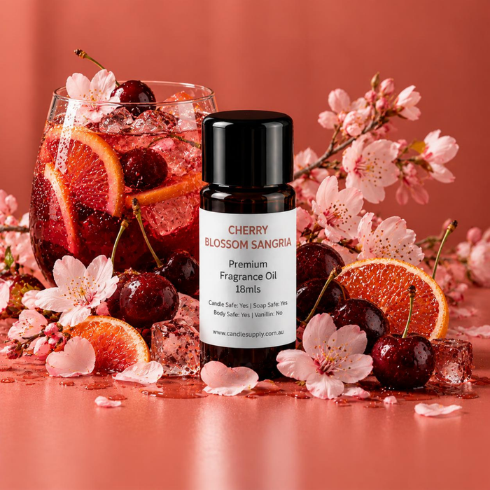 Cherry Blossom Sangria fragrance oil bottle with a red iced fruit drink, cherries, blood orange slices and pink blossom branches.