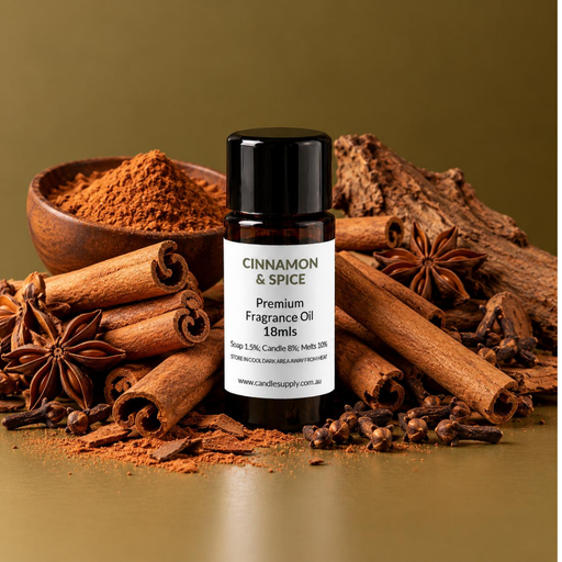 Cinnamon & Spice fragrance oil bottle with cinnamon sticks, ground spice in a wooden bowl, star anise, cloves and bark.