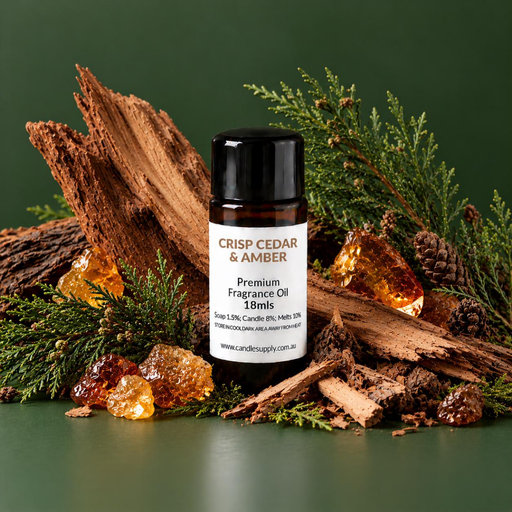 Crisp Cedar & Amber fragrance oil bottle with split wood, evergreen branches, small cones, green moss and amber-coloured chunks.