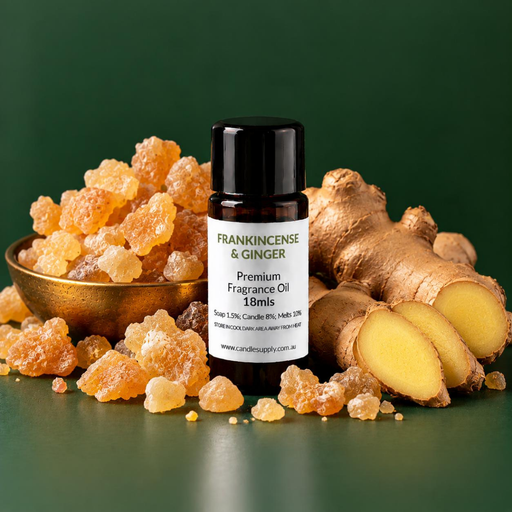 Frankincense & Ginger fragrance oil bottle with golden resin pieces in a brass bowl, whole ginger root and fresh ginger slices.