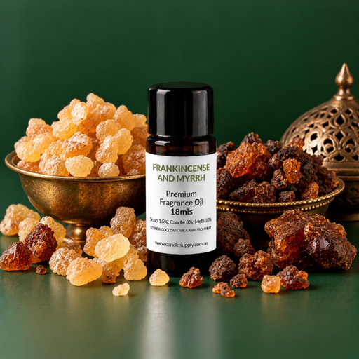 Frankincense and Myrrh fragrance oil bottle with pale gold and dark brown resin pieces, brass dishes and an ornate incense burner.
