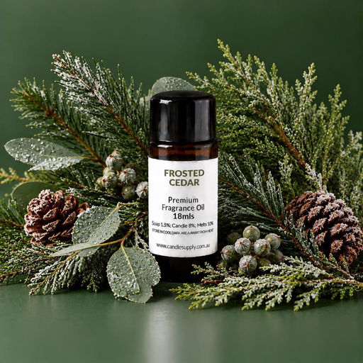 Frosted Cedar fragrance oil bottle with frost-dusted evergreen branches, pine cones, pale green leaves and small berries.