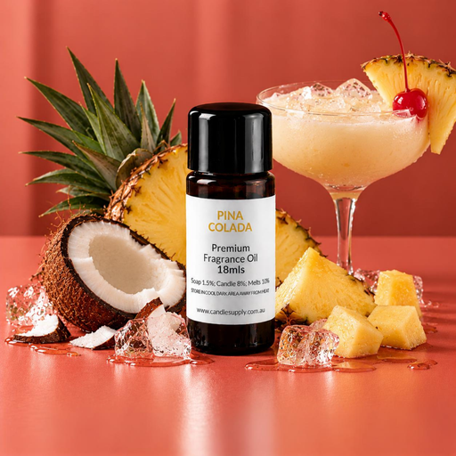 Pina Colada fragrance oil bottle with a creamy pineapple cocktail, coconut half, pineapple pieces, ice and a cherry garnish.