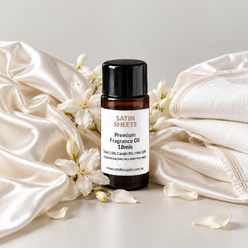 Satin Sheets fragrance oil bottle with cream satin, folded white linen, small white blossoms and scattered petals.
