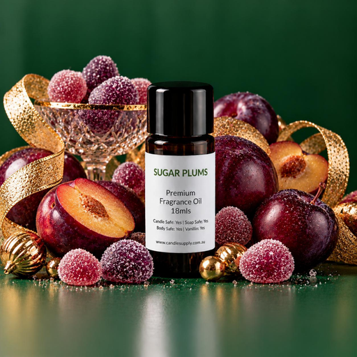 Sugar Plums fragrance oil bottle with whole and halved purple plums, sugar-coated sweets, gold ribbon and gold ornaments.