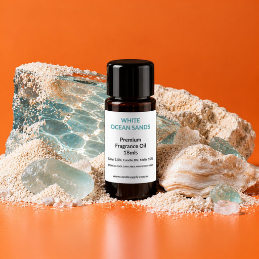 White Ocean Sands fragrance oil bottle with white sand, a large seashell, pale blue glass-like pieces and a slab patterned like sunlit water.
