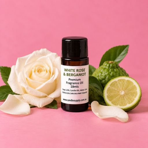 White Rose & Bergamot fragrance oil bottle with a white rose, whole and halved green citrus fruit, green leaves and white petals.