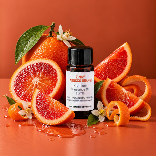 Zingy Tarocco Orange fragrance oil bottle with whole and sliced blood oranges, curled orange peel, green leaves and white blossoms.